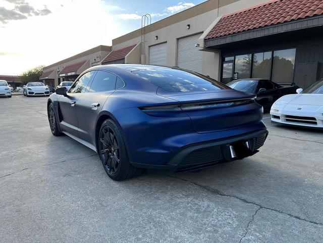 Matte blue Porsche Taycan outside 68 Auto Film in Milpitas