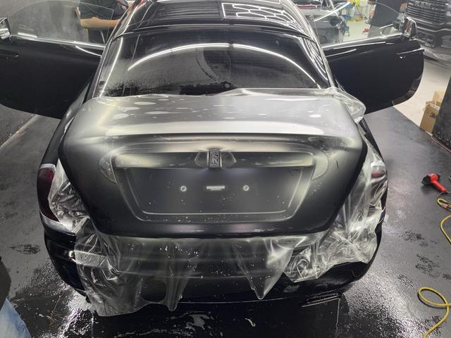 Rolls-Royce Wraith trunk with clear film being installed
